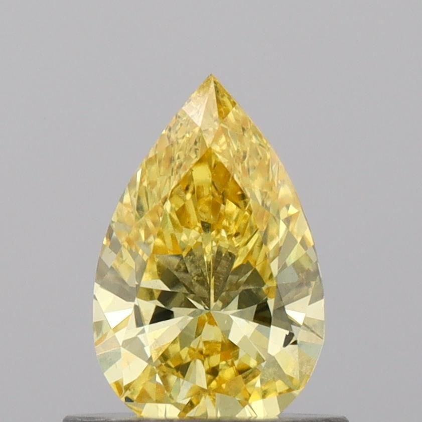 Loose Diamond - PEAR 0.63ct Fancy Vivid Yellow VS1: Loose Diamond - PEAR 0.63ct Fancy Vivid Yellow VS1 Source: This is a real non-mined Diamond that has been grown in a lab Shape: PEAR Carats: 0.63 Color: Fancy Vivid Yellow Certification: IGI Video: