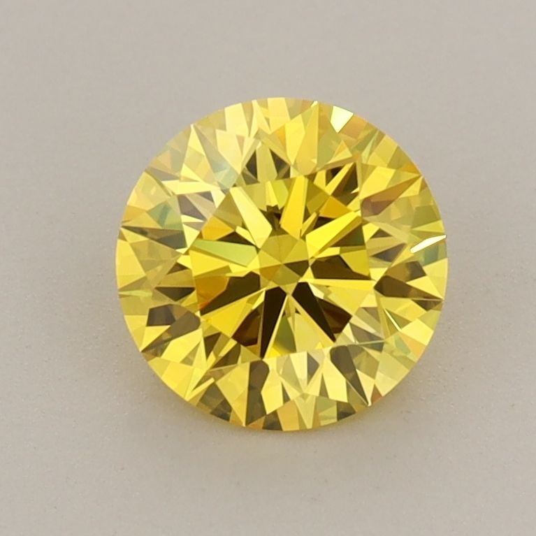 Ideal Loose Diamond - ROUND 1.04ct Fancy Vivid Yellow VVS2: Ideal Loose Diamond - ROUND 1.04ct Fancy Vivid Yellow VVS2 Source: This is a real non-mined Diamond that has been grown in a lab Shape: ROUND Carats: 1.04 Color: Fancy Vivid Yellow Certification: IGI 