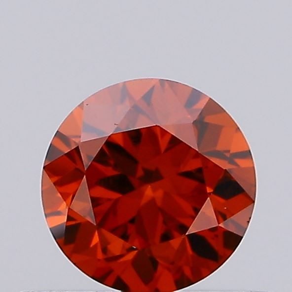 Loose Diamond - ROUND 0.36ct Fancy Vivid Orange VVS2: Loose Diamond - ROUND 0.36ct Fancy Vivid Orange VVS2 Source: This is a real non-mined Diamond that has been grown in a lab Shape: ROUND Carats: 0.36 Color: Fancy Vivid Orange Certification: IGI Video: