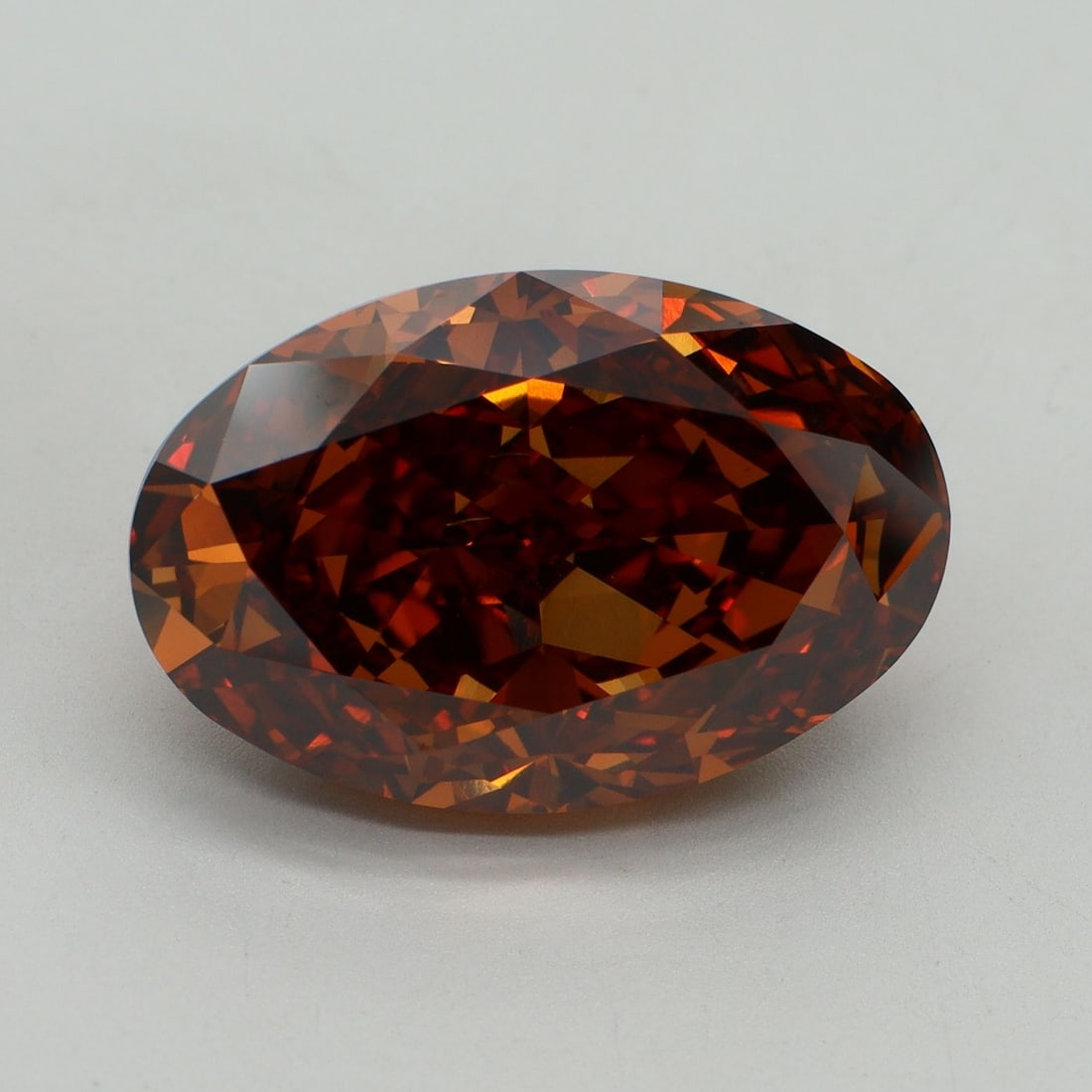 Loose Diamond - OVAL 12.1ct Fancy Vivid Orange VVS2: Loose Diamond - OVAL 12.1ct Fancy Vivid Orange VVS2 Source: This is a real non-mined Diamond that has been grown in a lab Shape: OVAL Carats: 12.1 Color: Fancy Vivid Orange Certification: IGI Video: