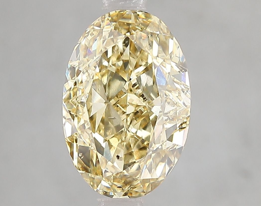 Loose Diamond - OVAL 3.08ct Fancy Yellow SI1: Loose Diamond - OVAL 3.08ct Fancy Yellow SI1 Source: This is a real non-mined Diamond that has been grown in a lab Shape: OVAL Carats: 3.08 Color: Fancy Yellow Certification: IGI Video: