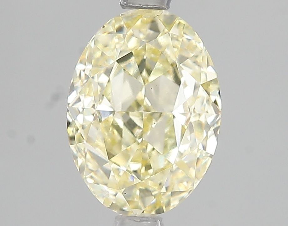 Loose Diamond - OVAL 2.5ct Fancy Light Yellow SI1: Loose Diamond - OVAL 2.5ct Fancy Light Yellow SI1 Source: This is a real non-mined Diamond that has been grown in a lab Shape: OVAL Carats: 2.5 Color: Fancy Light Yellow Certification: IGI Video: