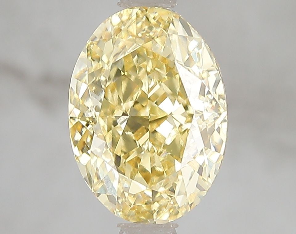 Loose Diamond - OVAL 2.56ct Fancy Vivid Yellow VS1: Loose Diamond - OVAL 2.56ct Fancy Vivid Yellow VS1 Source: This is a real non-mined Diamond that has been grown in a lab Shape: OVAL Carats: 2.56 Color: Fancy Vivid Yellow Certification: IGI Video: