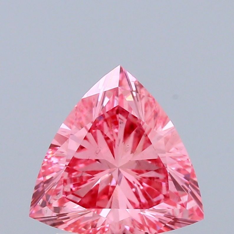 Loose Diamond - TRIANGULAR 1.09ct Fancy Vivid Pink VS1: Loose Diamond - TRIANGULAR 1.09ct Fancy Vivid Pink VS1 Source: This is a real non-mined Diamond that has been grown in a lab Shape: TRIANGULAR Carats: 1.09 Color: Fancy Vivid Pink Certification: IGI V