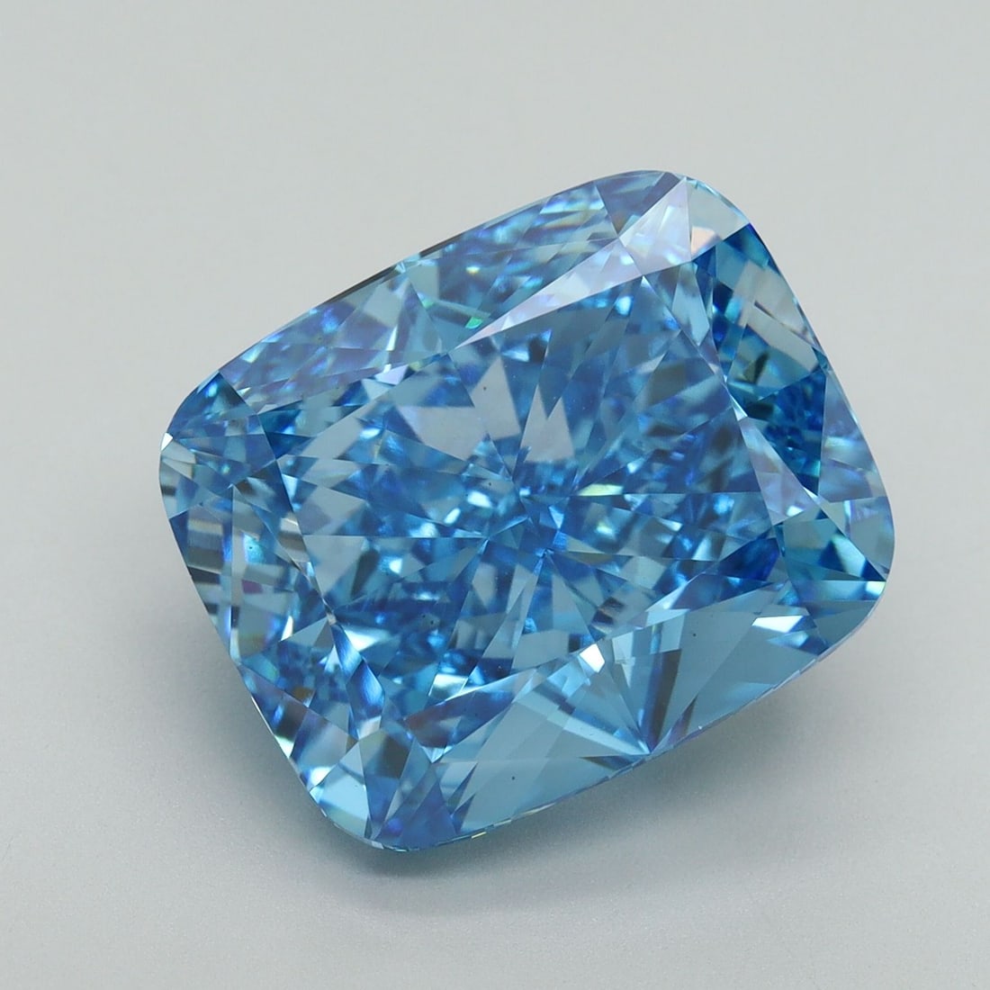Loose Diamond - CUSHION BRILLIANT 11.22ct Fancy Vivid Blue VS1: Loose Diamond - CUSHION BRILLIANT 11.22ct Fancy Vivid Blue VS1 Source: This is a real non-mined Diamond that has been grown in a lab Shape: CUSHION BRILLIANT Carats: 11.22 Color: Fancy Vivid Blue Cert