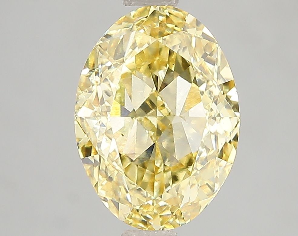 Loose Diamond - OVAL 3.1ct Fancy Vivid Yellow VS2: Loose Diamond - OVAL 3.1ct Fancy Vivid Yellow VS2 Source: This is a real non-mined Diamond that has been grown in a lab Shape: OVAL Carats: 3.1 Color: Fancy Vivid Yellow Certification: IGI Video: