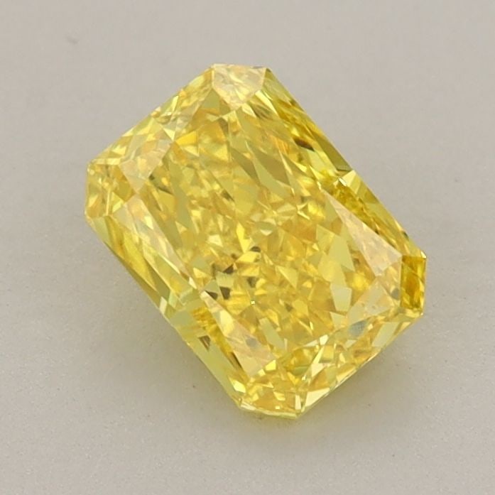Loose Diamond - RADIANT 0.89ct Fancy Vivid Yellow VS1: Loose Diamond - RADIANT 0.89ct Fancy Vivid Yellow VS1 Source: This is a real non-mined Diamond that has been grown in a lab Shape: RADIANT Carats: 0.89 Color: Fancy Vivid Yellow Certification: IGI Vid
