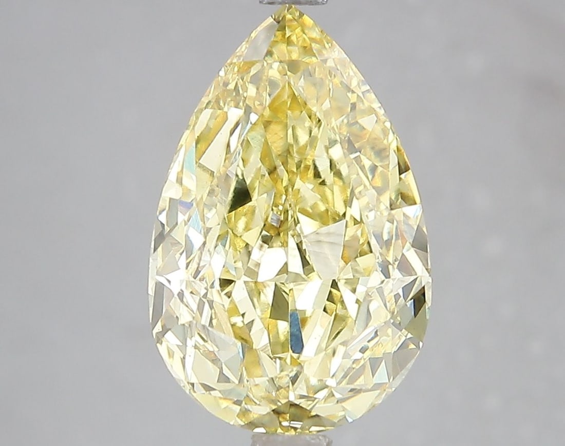 Loose Diamond - PEAR 5.19ct Fancy Vivid Yellow VS2: Loose Diamond - PEAR 5.19ct Fancy Vivid Yellow VS2 Source: This is a real non-mined Diamond that has been grown in a lab Shape: PEAR Carats: 5.19 Color: Fancy Vivid Yellow Certification: IGI Video: