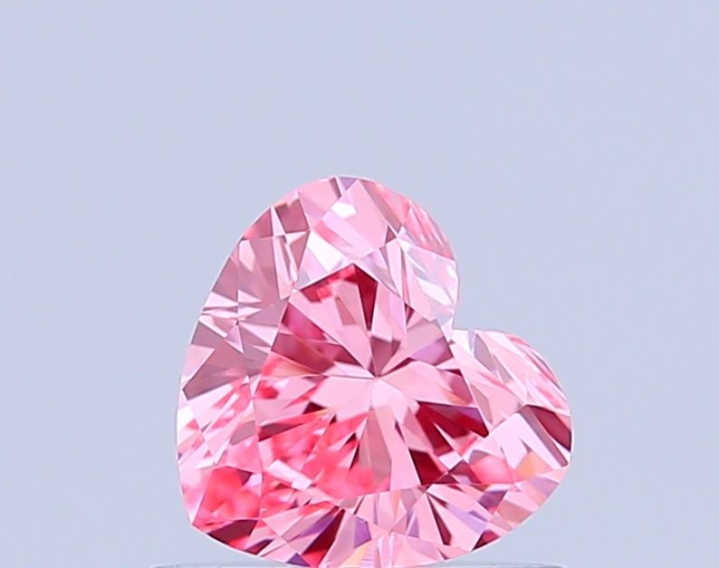 Loose Diamond - HEART 0.6ct Fancy Vivid Pink VVS2: Loose Diamond - HEART 0.6ct Fancy Vivid Pink VVS2 Source: This is a real non-mined Diamond that has been grown in a lab Shape: HEART Carats: 0.6 Color: Fancy Vivid Pink Certification: IGI Video: