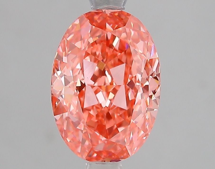 Loose Diamond - OVAL 2.1ct Fancy Vivid Pink VVS2: Loose Diamond - OVAL 2.1ct Fancy Vivid Pink VVS2 Source: This is a real non-mined Diamond that has been grown in a lab Shape: OVAL Carats: 2.1 Color: Fancy Vivid Pink Certification: IGI Video:
