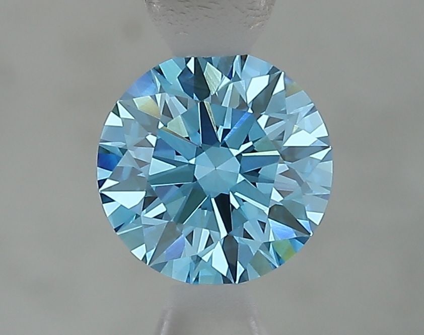 Ideal Loose Diamond - ROUND 1.05ct Fancy Vivid Blue VVS2: Ideal Loose Diamond - ROUND 1.05ct Fancy Vivid Blue VVS2 Source: This is a real non-mined Diamond that has been grown in a lab Shape: ROUND Carats: 1.05 Color: Fancy Vivid Blue Certification: IGI Vide