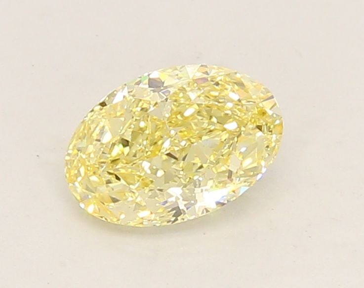 Loose Diamond - OVAL 0.79ct Fancy Yellow VS1: Loose Diamond - OVAL 0.79ct Fancy Yellow VS1 Source: This is a real non-mined Diamond that has been grown in a lab Shape: OVAL Carats: 0.79 Color: Fancy Yellow Certification: IGI Video: