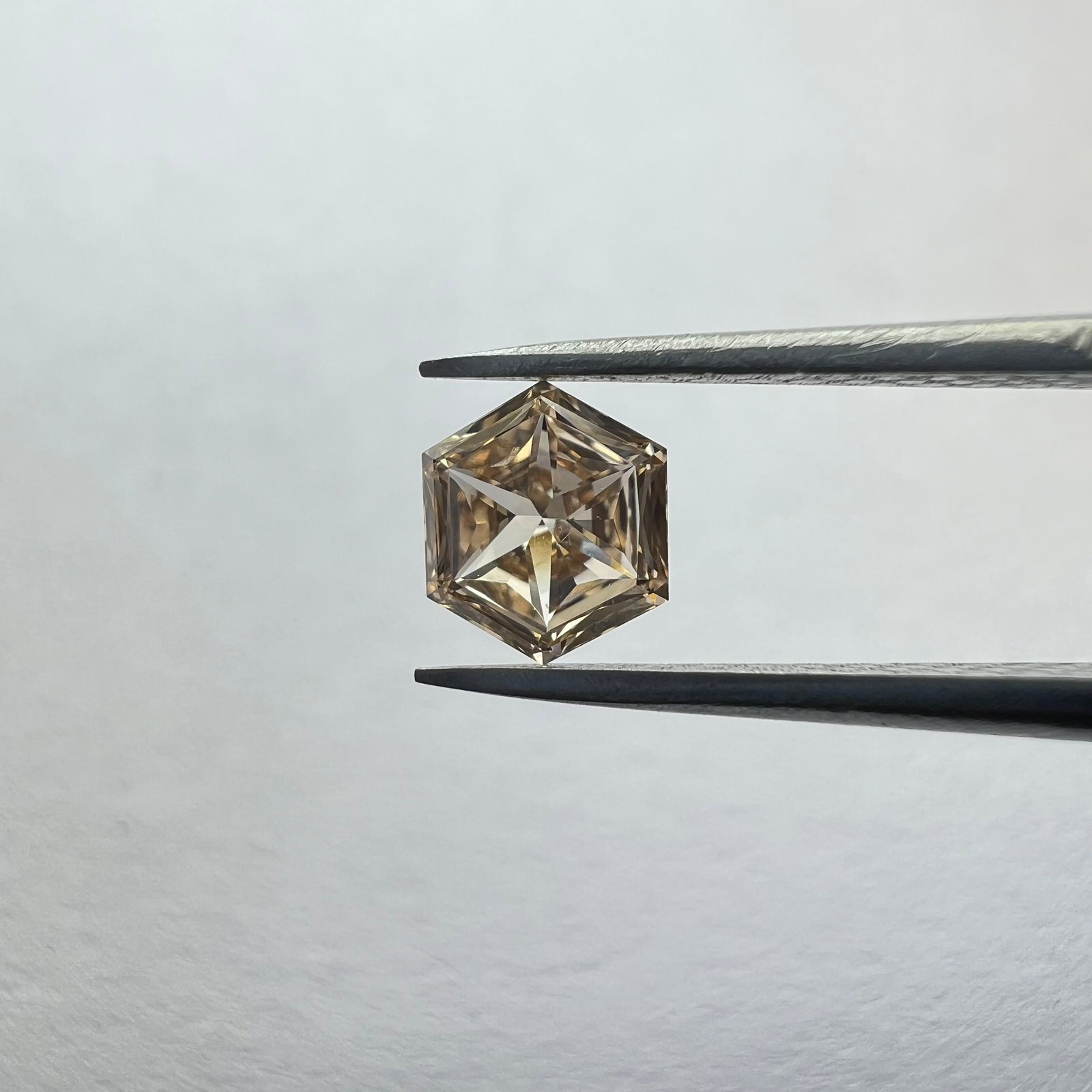Loose Diamond - HEXAGONAL 0.29ct Brown VS1: Loose Diamond - HEXAGONAL 0.29ct Brown VS1 Source: This is a real non-mined Diamond that has been grown in a lab Shape: HEXAGONAL Carats: 0.29 Color: Brown Certification: NONE The Diamond Depot Guaran