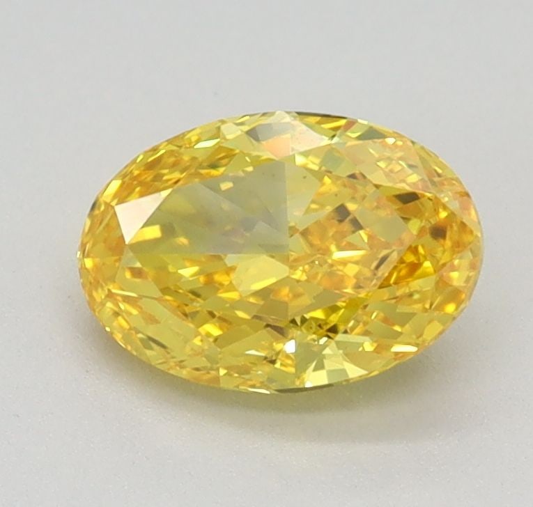 Loose Diamond - OVAL 0.79ct Fancy Vivid Yellow VS1: Loose Diamond - OVAL 0.79ct Fancy Vivid Yellow VS1 Source: This is a real non-mined Diamond that has been grown in a lab Shape: OVAL Carats: 0.79 Color: Fancy Vivid Yellow Certification: IGI Video:
