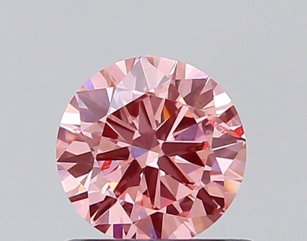 Loose Diamond - ROUND 0.65ct Fancy Vivid Pink SI2: Loose Diamond - ROUND 0.65ct Fancy Vivid Pink SI2 Source: This is a real non-mined Diamond that has been grown in a lab Shape: ROUND Carats: 0.65 Color: Fancy Vivid Pink Certification: NONE The Diamon