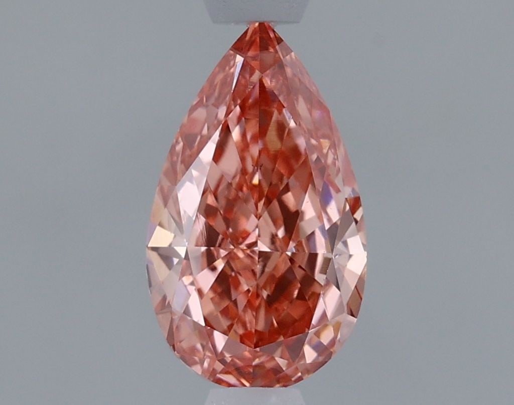 Loose Diamond - PEAR 0.95ct Fancy Vivid Pink VS1: Loose Diamond - PEAR 0.95ct Fancy Vivid Pink VS1 Source: This is a real non-mined Diamond that has been grown in a lab Shape: PEAR Carats: 0.95 Color: Fancy Vivid Pink Certification: IGI Video: