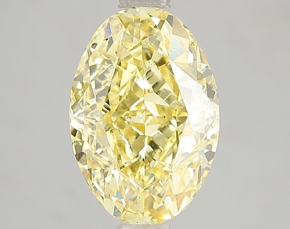 Loose Diamond - OVAL 3.06ct Fancy Vivid Yellow VS2: Loose Diamond - OVAL 3.06ct Fancy Vivid Yellow VS2 Source: This is a real non-mined Diamond that has been grown in a lab Shape: OVAL Carats: 3.06 Color: Fancy Vivid Yellow Certification: IGI Video: