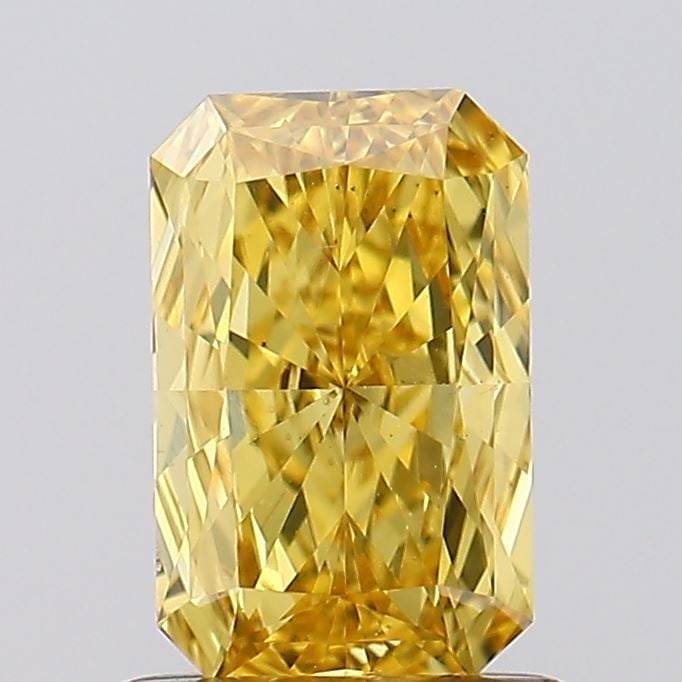 Loose Diamond - RADIANT 0.75ct Fancy Vivid Brownish Yellow VS2: Loose Diamond - RADIANT 0.75ct Fancy Vivid Brownish Yellow VS2 Source: This is a real non-mined Diamond that has been grown in a lab Shape: RADIANT Carats: 0.75 Color: Fancy Vivid Brownish Yellow Cert
