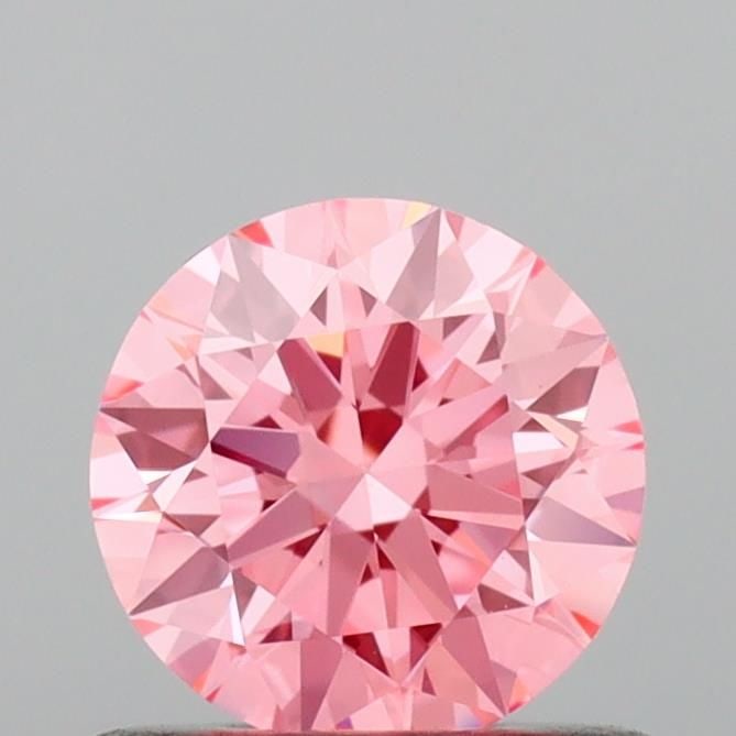 Ideal Loose Diamond - ROUND 0.63ct Fancy Vivid Pink VVS2: Ideal Loose Diamond - ROUND 0.63ct Fancy Vivid Pink VVS2 Source: This is a real non-mined Diamond that has been grown in a lab Shape: ROUND Carats: 0.63 Color: Fancy Vivid Pink Certification: IGI Vide
