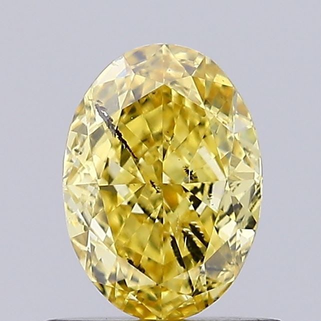 Loose Diamond - OVAL 0.71ct Fancy Vivid Yellow SI2: Loose Diamond - OVAL 0.71ct Fancy Vivid Yellow SI2 Source: This is a real non-mined Diamond that has been grown in a lab Shape: OVAL Carats: 0.71 Color: Fancy Vivid Yellow Certification: IGI Video: