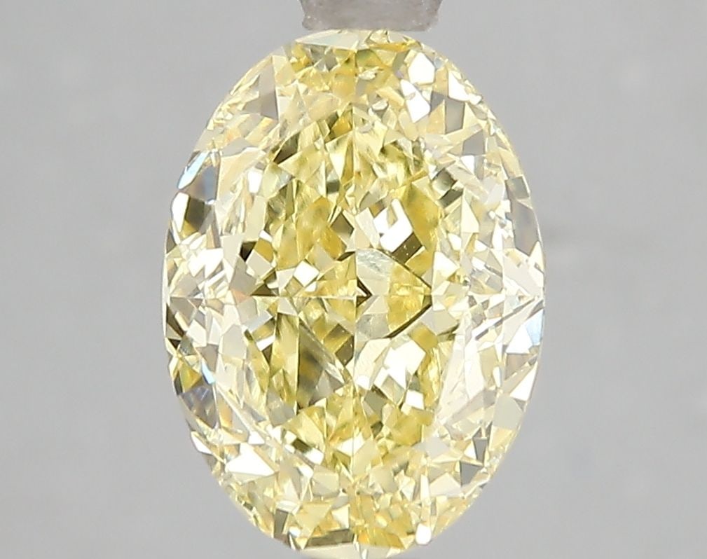 Loose Diamond - OVAL 3.01ct Fancy Vivid Yellow VS2: Loose Diamond - OVAL 3.01ct Fancy Vivid Yellow VS2 Source: This is a real non-mined Diamond that has been grown in a lab Shape: OVAL Carats: 3.01 Color: Fancy Vivid Yellow Certification: IGI Video: