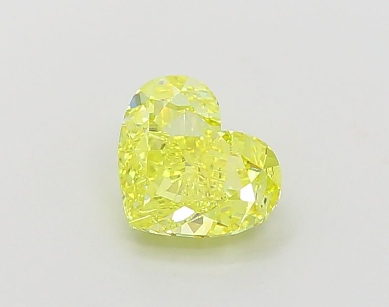 Loose Diamond - HEART 1.26ct Fancy Vivid Yellow VVS2: Loose Diamond - HEART 1.26ct Fancy Vivid Yellow VVS2 Source: This is a real non-mined Diamond that has been grown in a lab Shape: HEART Carats: 1.26 Color: Fancy Vivid Yellow Certification: IGI Video: