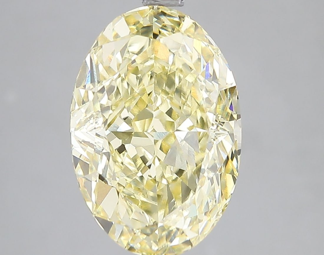 Loose Diamond - OVAL 5.07ct Fancy Vivid Yellow VS1: Loose Diamond - OVAL 5.07ct Fancy Vivid Yellow VS1 Source: This is a real non-mined Diamond that has been grown in a lab Shape: OVAL Carats: 5.07 Color: Fancy Vivid Yellow Certification: IGI Video: