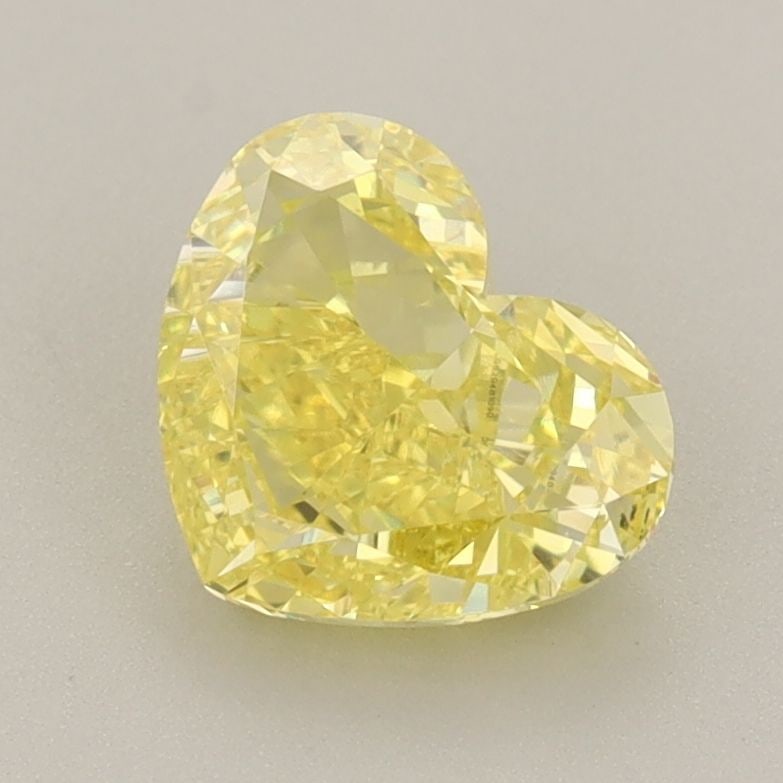 Loose Diamond - HEART 1.55ct Fancy Vivid Yellow VVS2: Loose Diamond - HEART 1.55ct Fancy Vivid Yellow VVS2 Source: This is a real non-mined Diamond that has been grown in a lab Shape: HEART Carats: 1.55 Color: Fancy Vivid Yellow Certification: IGI Video: