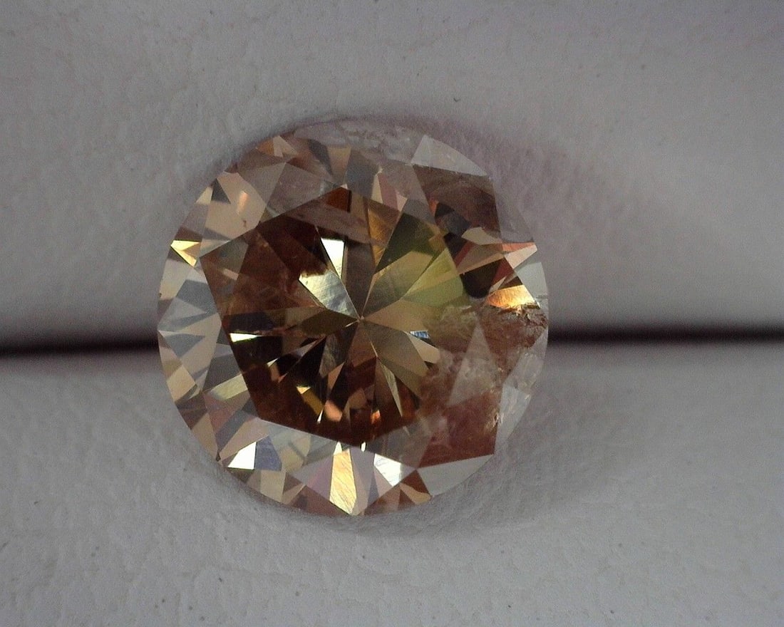 Loose Diamond - ROUND 1.03ct Brown I1: Loose Diamond - ROUND 1.03ct Brown I1 Source: Natural Shape: ROUND Carats: 1.03 Color: Brown Certification: OTHER The Diamond Depot Guarantee: All items in this auction are guaranteed to be 100% authe