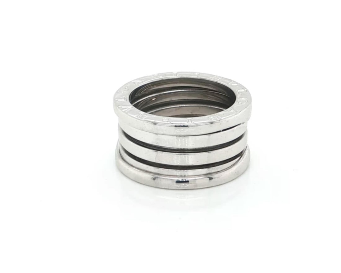 Bvlgari B.zero1 18k White Gold Four Band Ring US 5 EU 50: Bvlgari B.zero1 18k White Gold Four Band Ring US 5 EU 50 Authentic Bvlgari B.zero1 four-band ring crafted in 18k white gold. This signed ring features the collection's iconic spiral-inspired design wi