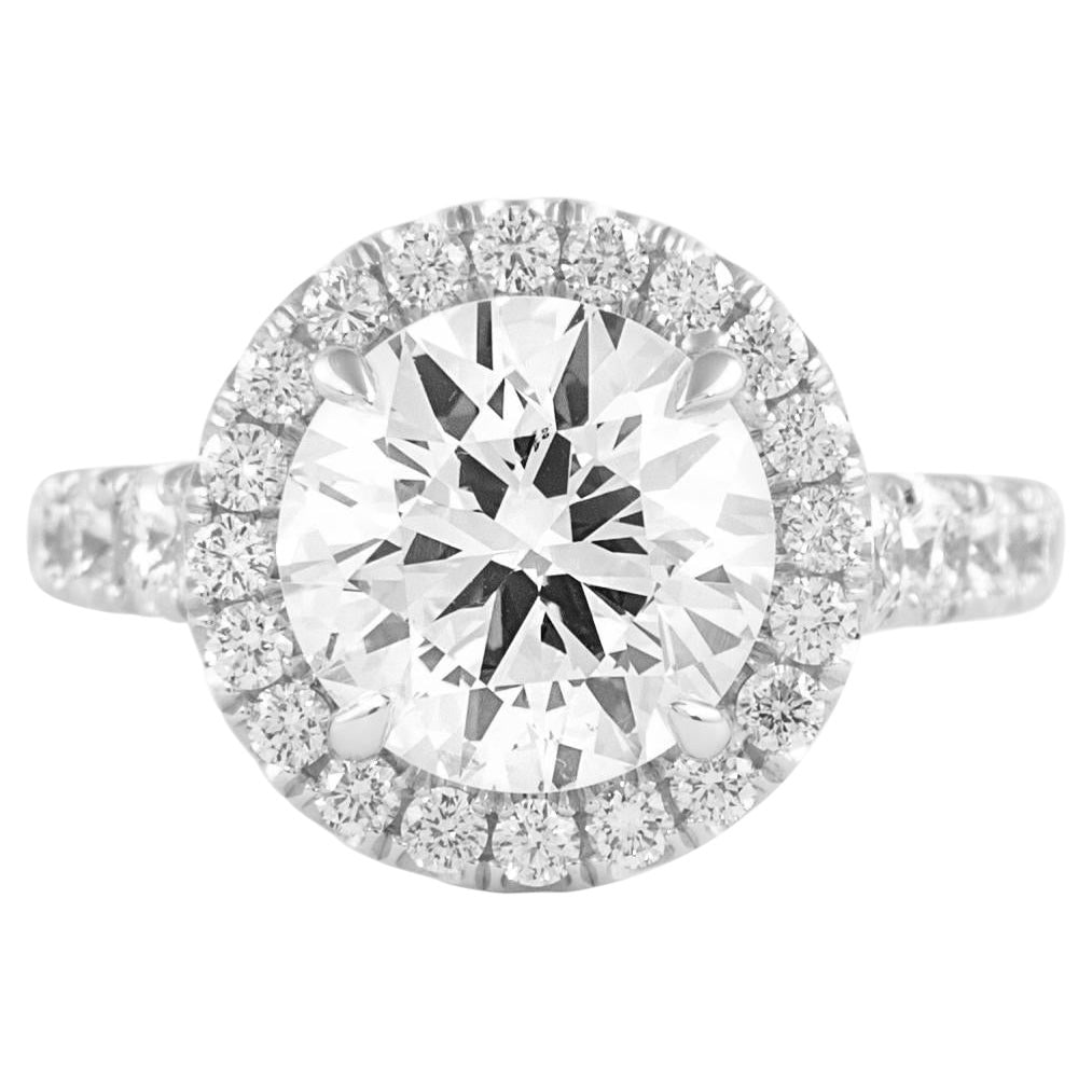 2.80ct GIA Round Diamond Halo Ring 18k White Gold: 2.80ct GIA Round Diamond Halo Ring 18k White Gold This exquisite engagement ring features a stunning 2.80 ct round brilliant diamond at its center, accompanied by a brilliant halo of 55 additional dia