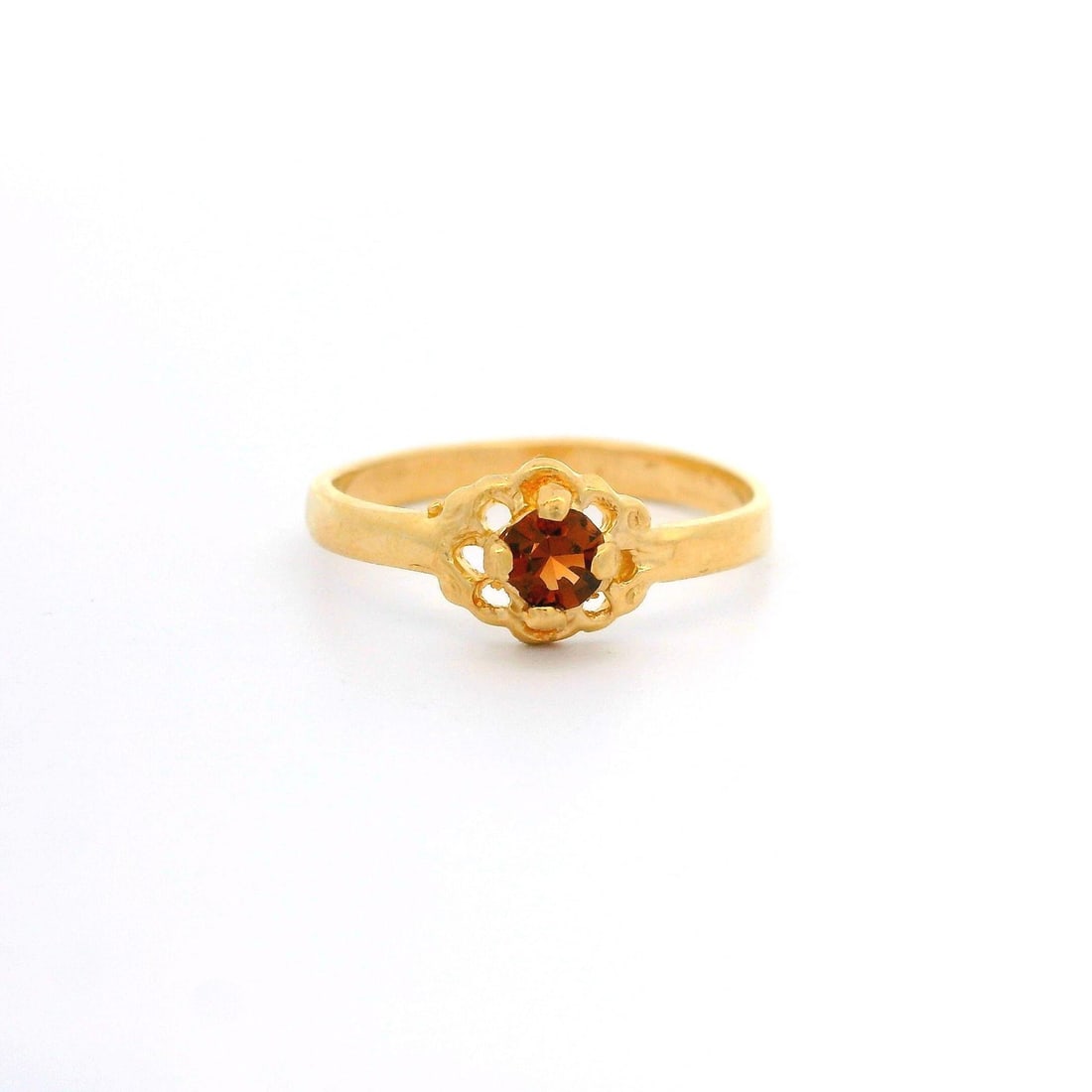 Size 2 Pinky Ring in 14k Yellow Gold with Citrine Flower Design: Size 2 Pinky Ring in 14k Yellow Gold with Citrine Flower Design This petite pinky ring features a natural round brilliant cut citrine set in a flower design. The stone displays a deep yellow-orange co
