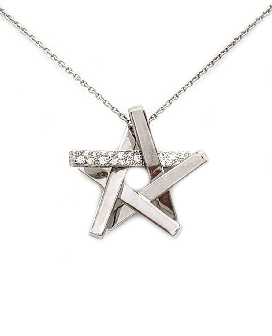 Tiffany & Co. Frank Gehry Axis 18k White Gold Star Pendant Necklace with Diamonds: Tiffany & Co. Frank Gehry Axis 18k White Gold Star Pendant Necklace with Diamonds This exquisite pendant necklace, designed by Frank Gehry for Tiffany & Co., features a striking star design crafted fr