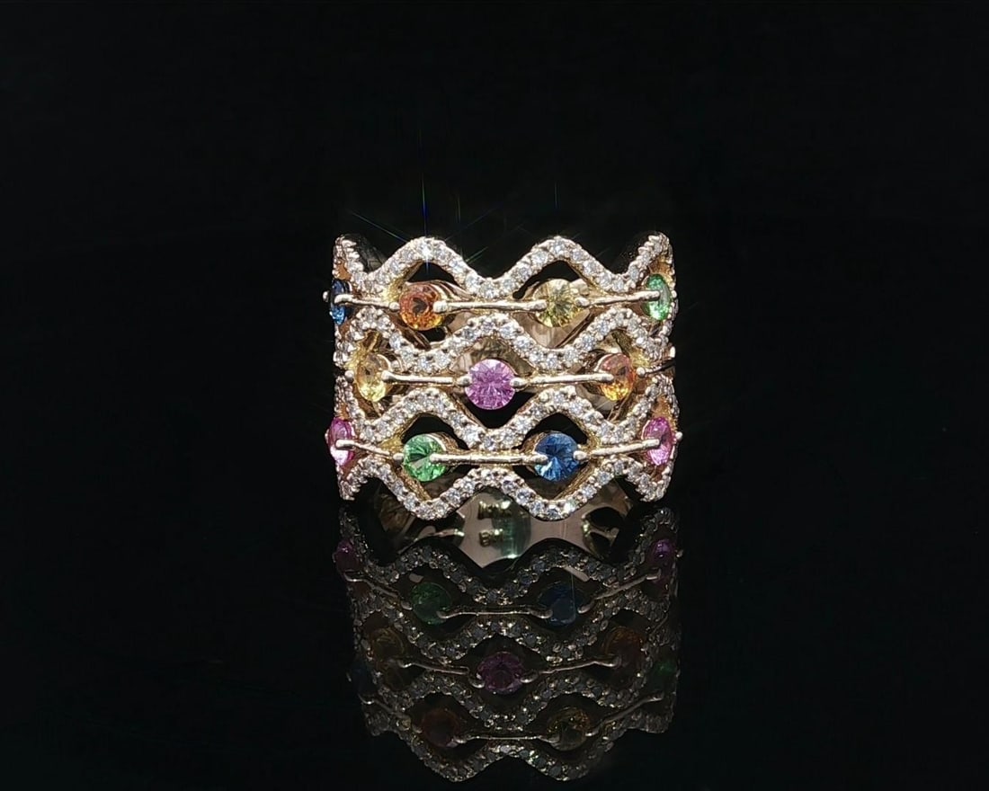 14k Yellow Gold Wavy Band Ring with Multicolor Tourmaline Diamonds: 14k Yellow Gold Wavy Band Ring with Multicolor Tourmaline Diamonds This stunning wide wavy band ring features a vibrant array of natural gemstones, including (11) round brilliant cut multicolor tourma