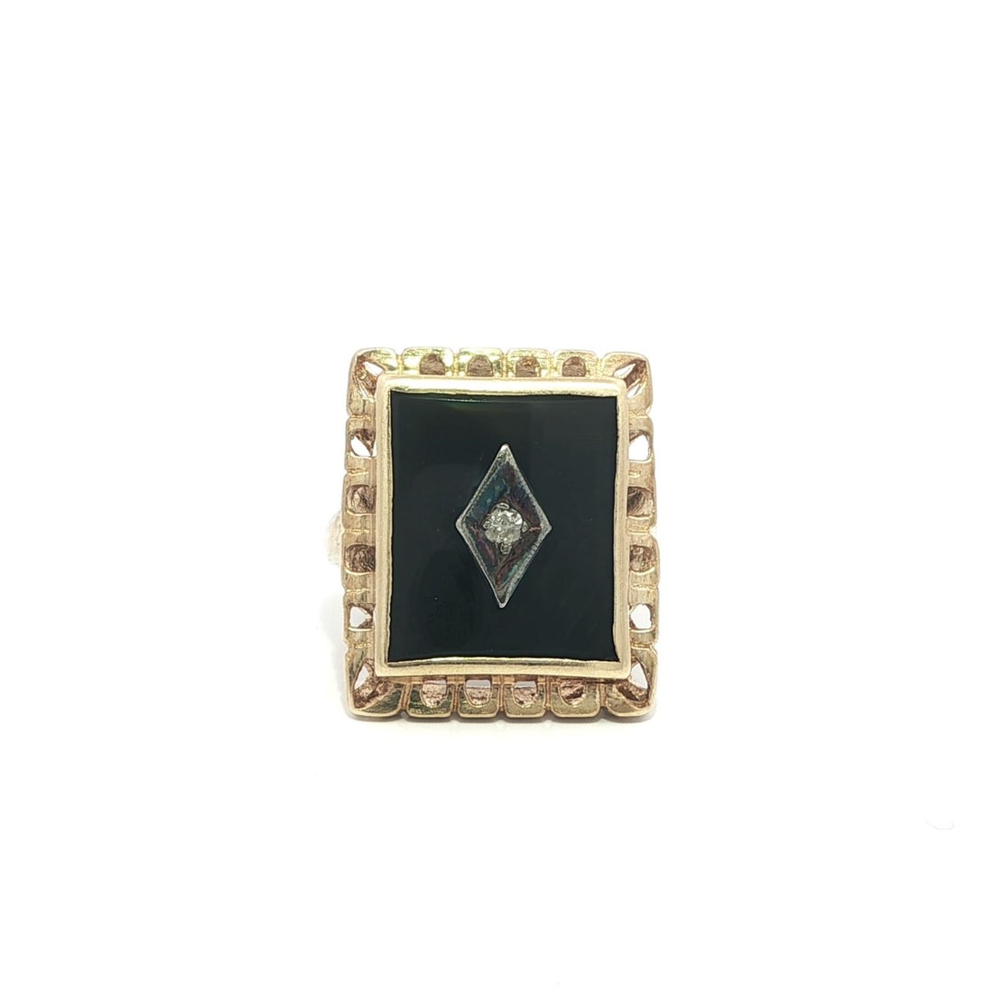 Rectangular Black Onyx and Diamond Cocktail Ring in Vintage Yellow Gold: Rectangular Black Onyx and Diamond Cocktail Ring in Vintage Yellow Gold This vintage dinner ring features a rectangular natural black onyx centerpiece accented by a single brilliant white diamond at t