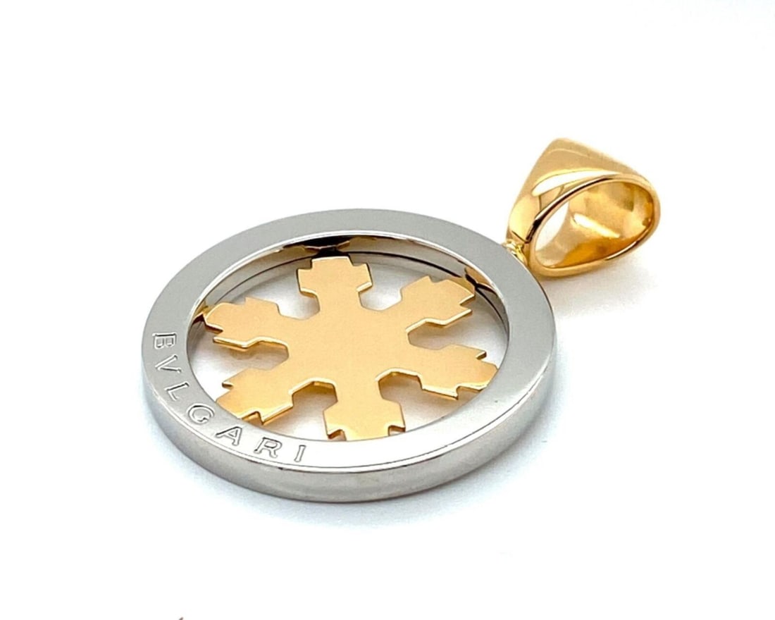 Bvlgari Tondo Snowflake Pendant in 18k Gold and Stainless Steel: Bvlgari Tondo Snowflake Pendant in 18k Gold and Stainless Steel Pre-owned Bvlgari Tondo Snowflake charm pendant with the collection's signature round silhouette and snowflake motif. Crafted in 18k