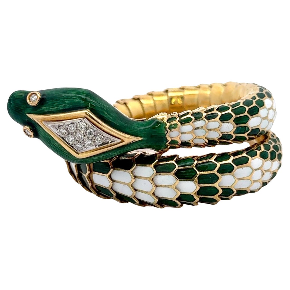Vintage 1960s Harbor Diamonds 18K Gold Diamond Snake Bracelet: Vintage 1960s Harbor Diamonds 18K Gold Diamond Snake Bracelet This stunning vintage bracelet features a unique snake motif crafted from 18 karat yellow gold. The bracelet showcases vibrant emerald gre