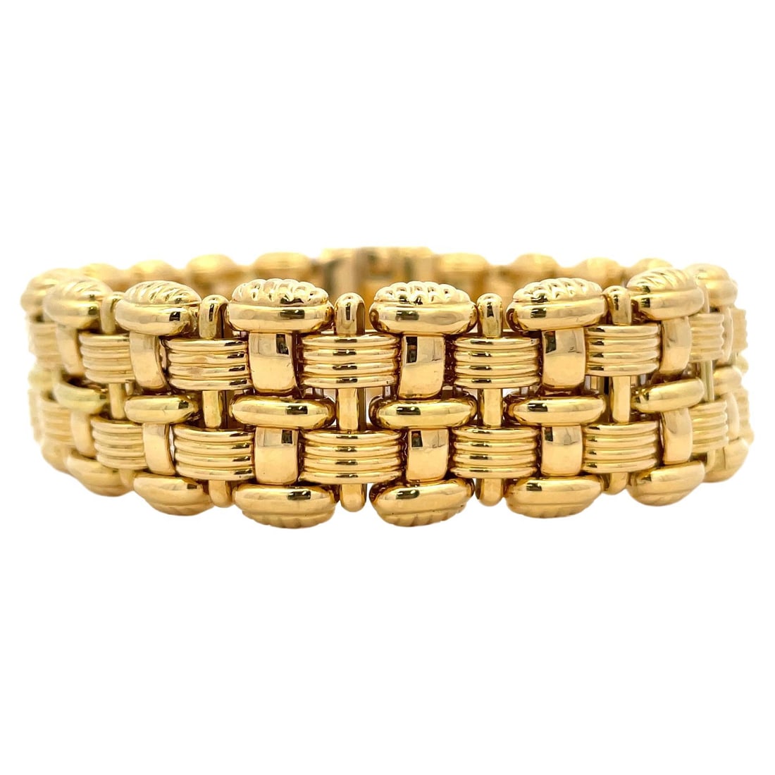 Contemporary Italian Woven Bracelet 18K Yellow Gold by OTC 47.1g: Contemporary Italian Woven Bracelet 18K Yellow Gold by OTC 47.1g This exquisite Italian Woven Bracelet is crafted from 18 karat yellow gold, showcasing a beautifully intricate woven motif design. Weig