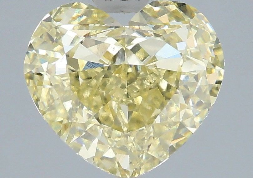 Loose Diamond - HEART 3.54ct Fancy Yellow VVS2: Loose Diamond - HEART 3.54ct Fancy Yellow VVS2 Source: This is a real non-mined Diamond that has been grown in a lab Shape: HEART Carats: 3.54 Color: Fancy Yellow Certification: IGI Video: