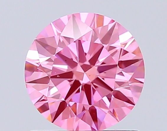 Ideal Loose Diamond - ROUND 1.01ct Fancy Vivid Pink VS1: Ideal Loose Diamond - ROUND 1.01ct Fancy Vivid Pink VS1 Source: This is a real non-mined Diamond that has been grown in a lab Shape: ROUND Carats: 1.01 Color: Fancy Vivid Pink Certification: IGI Video