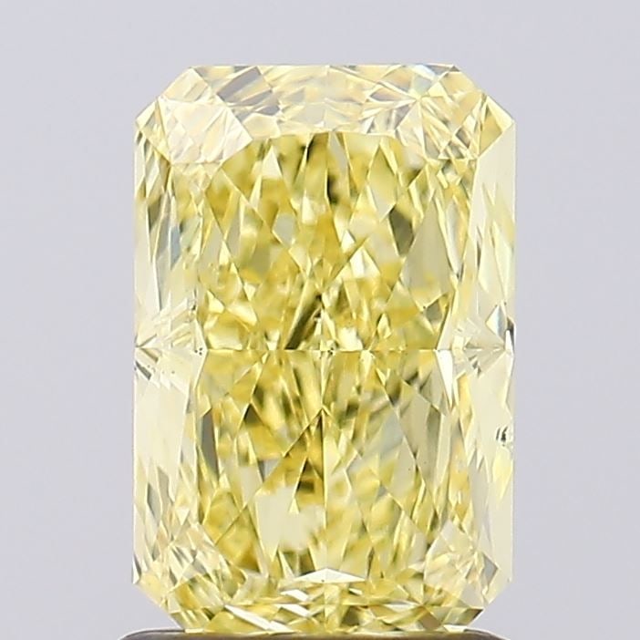 Loose Diamond - RADIANT 1.5ct Fancy Vivid Yellow VS2: Loose Diamond - RADIANT 1.5ct Fancy Vivid Yellow VS2 Source: This is a real non-mined Diamond that has been grown in a lab Shape: RADIANT Carats: 1.5 Color: Fancy Vivid Yellow Certification: IGI Video