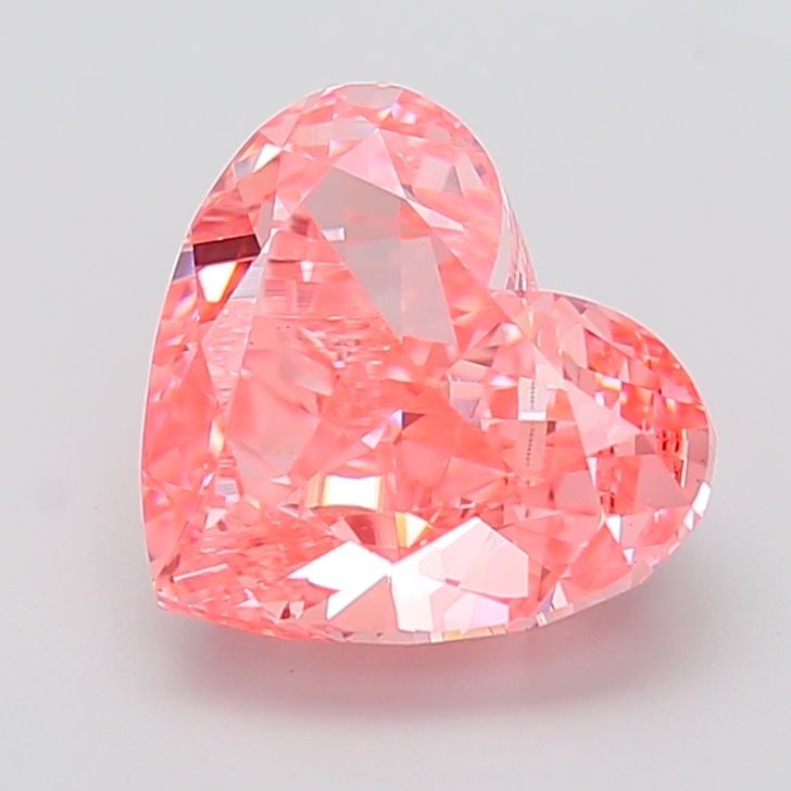 Loose Diamond - HEART 5.8ct Fancy Vivid Pink VS1: Loose Diamond - HEART 5.8ct Fancy Vivid Pink VS1 Source: This is a real non-mined Diamond that has been grown in a lab Shape: HEART Carats: 5.8 Color: Fancy Vivid Pink Certification: IGI Video: Video