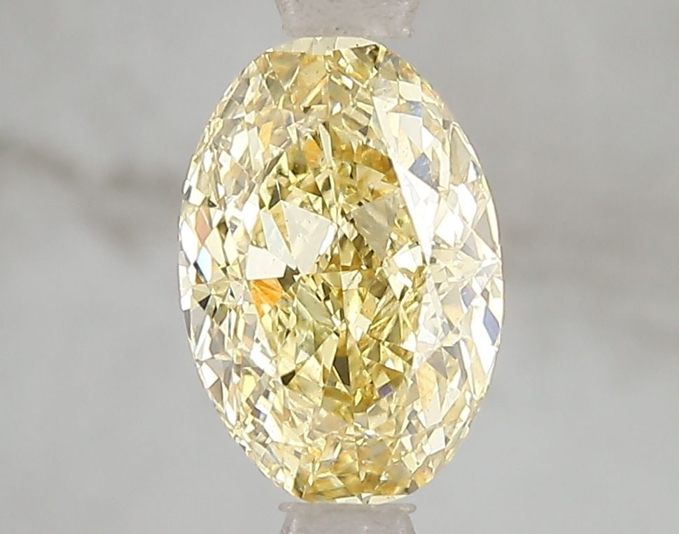 Loose Diamond - OVAL 2.03ct Fancy Vivid Yellow VS2: Loose Diamond - OVAL 2.03ct Fancy Vivid Yellow VS2 Source: This is a real non-mined Diamond that has been grown in a lab Shape: OVAL Carats: 2.03 Color: Fancy Vivid Yellow Certification: IGI Video: