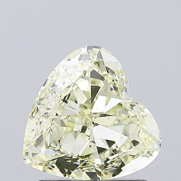 Loose Diamond - HEART 1.5ct Fancy Light Yellow VS2: Loose Diamond - HEART 1.5ct Fancy Light Yellow VS2 Source: This is a real non-mined Diamond that has been grown in a lab Shape: HEART Carats: 1.5 Color: Fancy Light Yellow Certification: IGI Video: