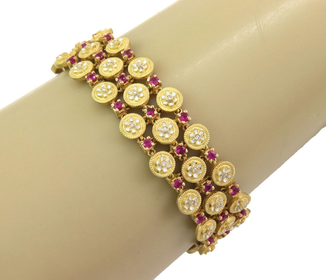 Exquisite 18k Gold Ruby Diamond Enamel Bracelet Estate Jewelry: Exquisite 18k Gold Ruby Diamond Enamel Bracelet Estate Jewelry This exquisite estate bracelet showcases a stunning design crafted from 18k yellow gold. It features three rows of small round button lin