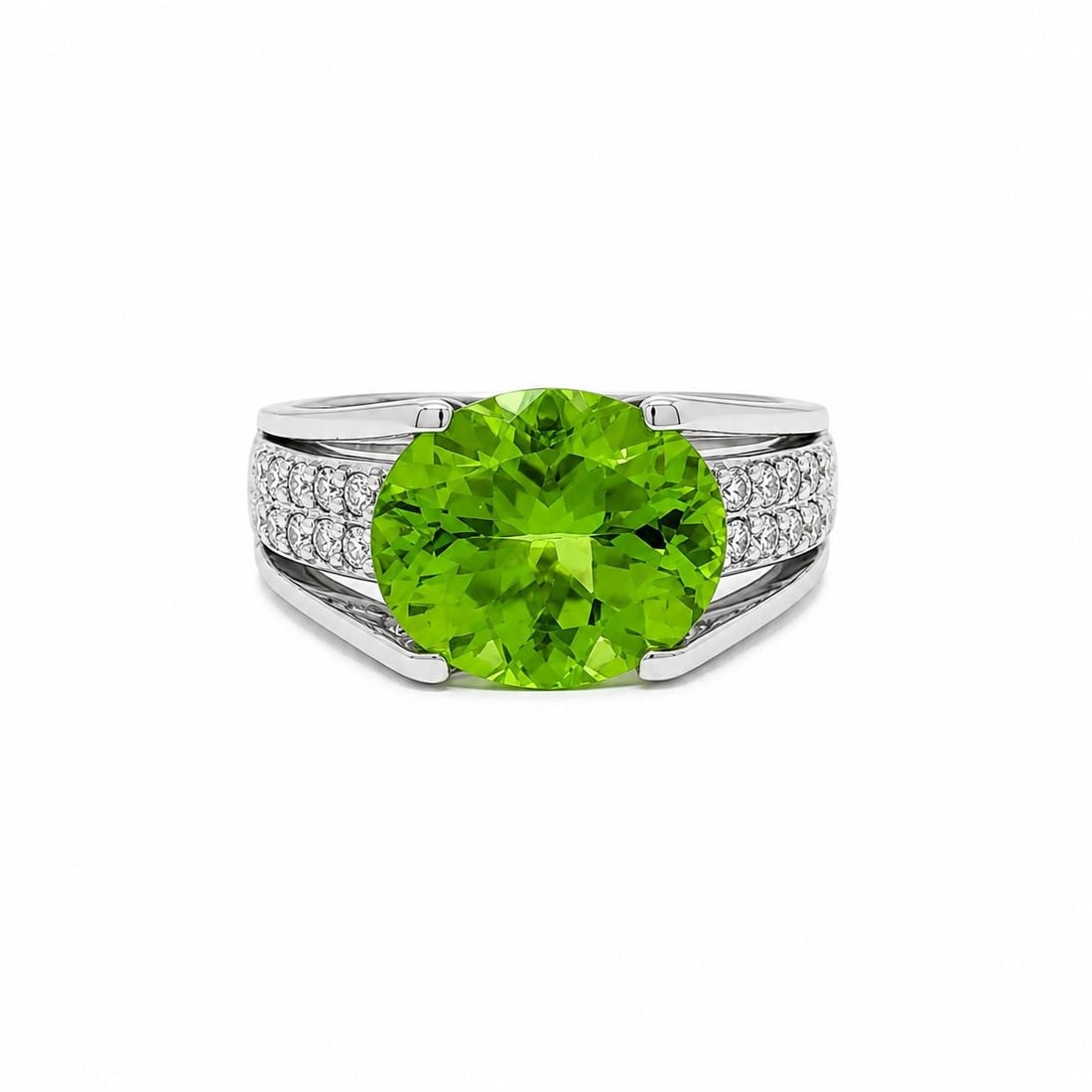 Platinum Cocktail Ring with 3.75ctw Oval Peridot and Pave Diamonds: Platinum Cocktail Ring with 3.75ctw Oval Peridot and Pave Diamonds This women's cocktail ring features a natural oval brilliant cut peridot in a rich lime green color, accented by 20 round brilliant c