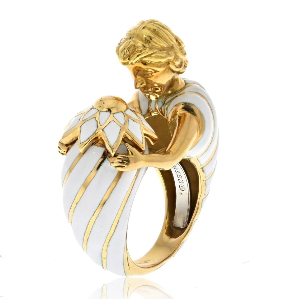 David Webb Platinum 18K Gold Virgo Male Figure Enamel Ring: David Webb Platinum 18K Gold Virgo Male Figure Enamel Ring Celebrate your individuality with this estate David Webb Platinum & 18K Yellow Gold Virgo Male Figure White Enamel Ring. This unique piece is