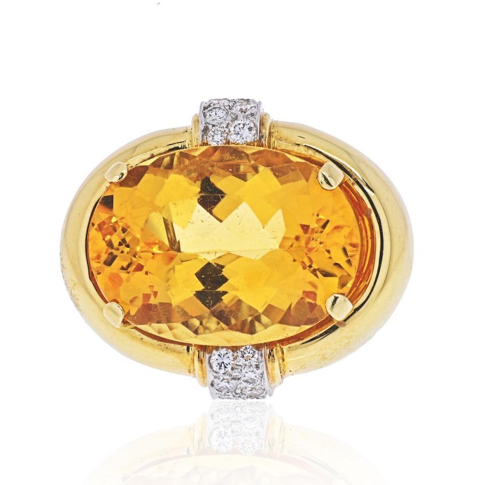 David Webb Platinum 18K Gold Oval Citrine Diamond Ring Estate: David Webb Platinum 18K Gold Oval Citrine Diamond Ring Estate This exquisite estate ring from David Webb features a stunning oval-shaped orange citrine, weighing approximately 17.95cts, beautifully ac