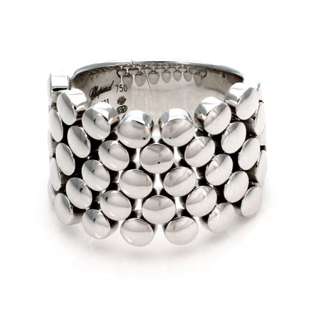 Chopard Flexible Bead Band Ring 18k White Gold Size 6.5 Certificate: Chopard Flexible Bead Band Ring 18k White Gold Size 6.5 Certificate Pre-owned Chopard flexible bead band ring in 18k white gold with a sculptural bead-front design. This signed ring is made in Italy a