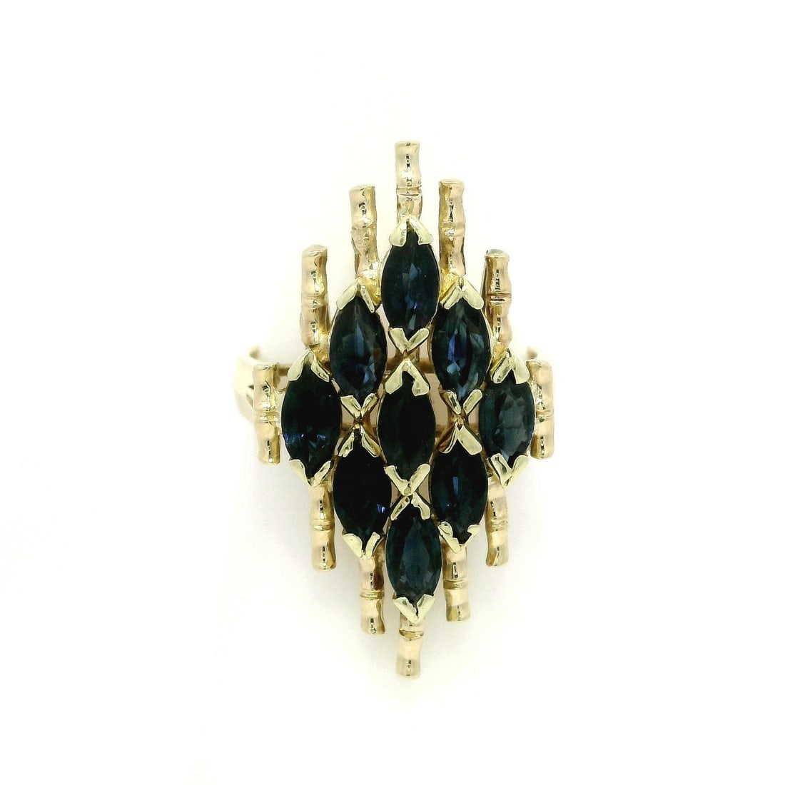 Vintage 14k Yellow Gold 2.16ct Blue Sapphire Mosaic Ring: Vintage 14k Yellow Gold 2.16ct Blue Sapphire Mosaic Ring This exquisite vintage cocktail ring features a stunning navette shape adorned with nine natural genuine sapphires. Each marquise-cut sapphire,